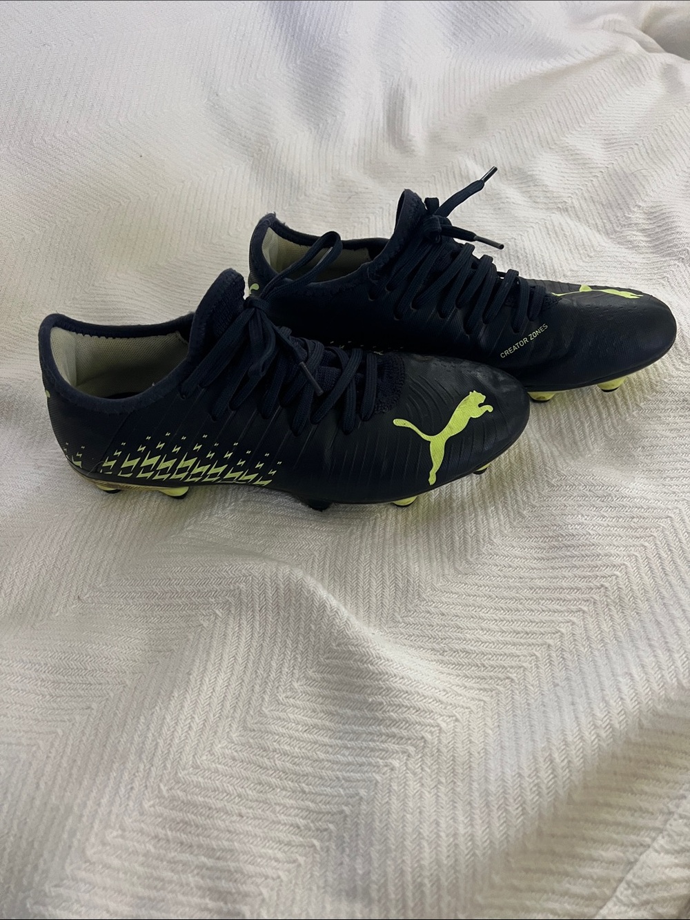 Puma Men’s Black Soccer Cleats with Neon green Accents